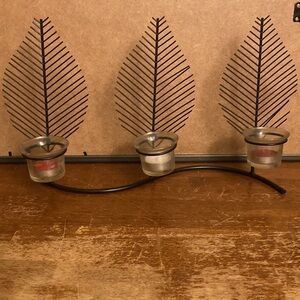 Metal leaf votive candle holder. Stands on its own.